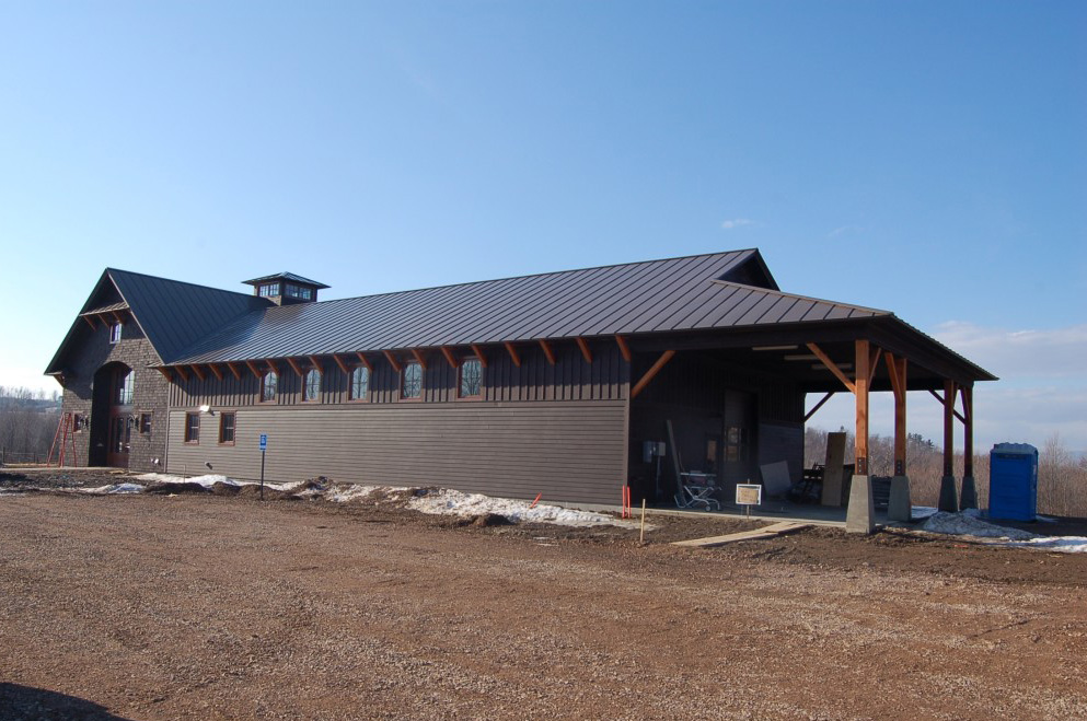 Finished siding over wall panels on a Shelburne Vineyard commercial building