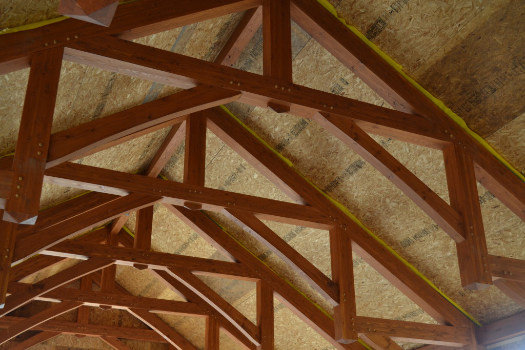 Roof SIPs over timber trusses on a commercial SIP installation