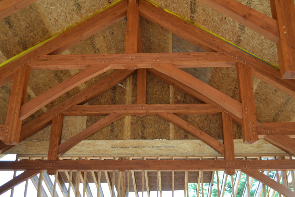 Roof SIPs over timber trusses on a commercial SIP installation