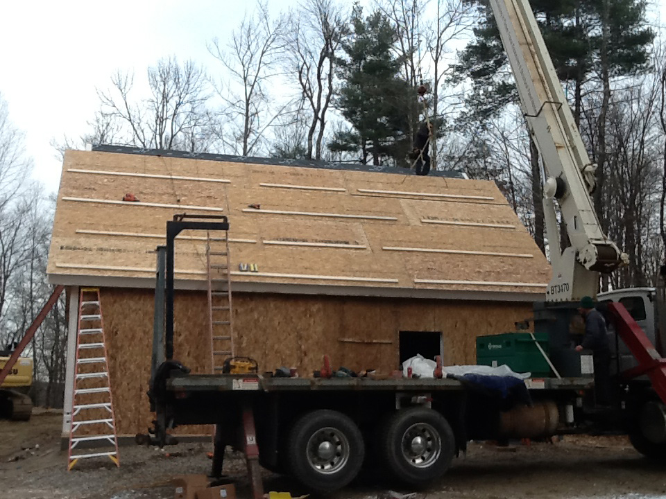 Installing roof SIPs over a timber frame with a crane