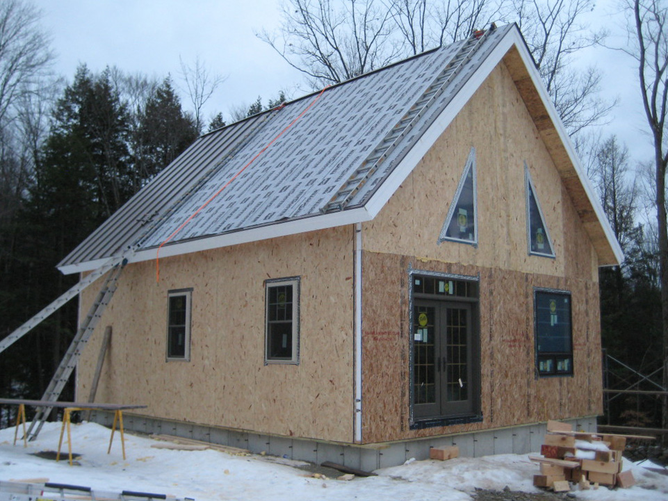 Standing seam over R38 roof panels